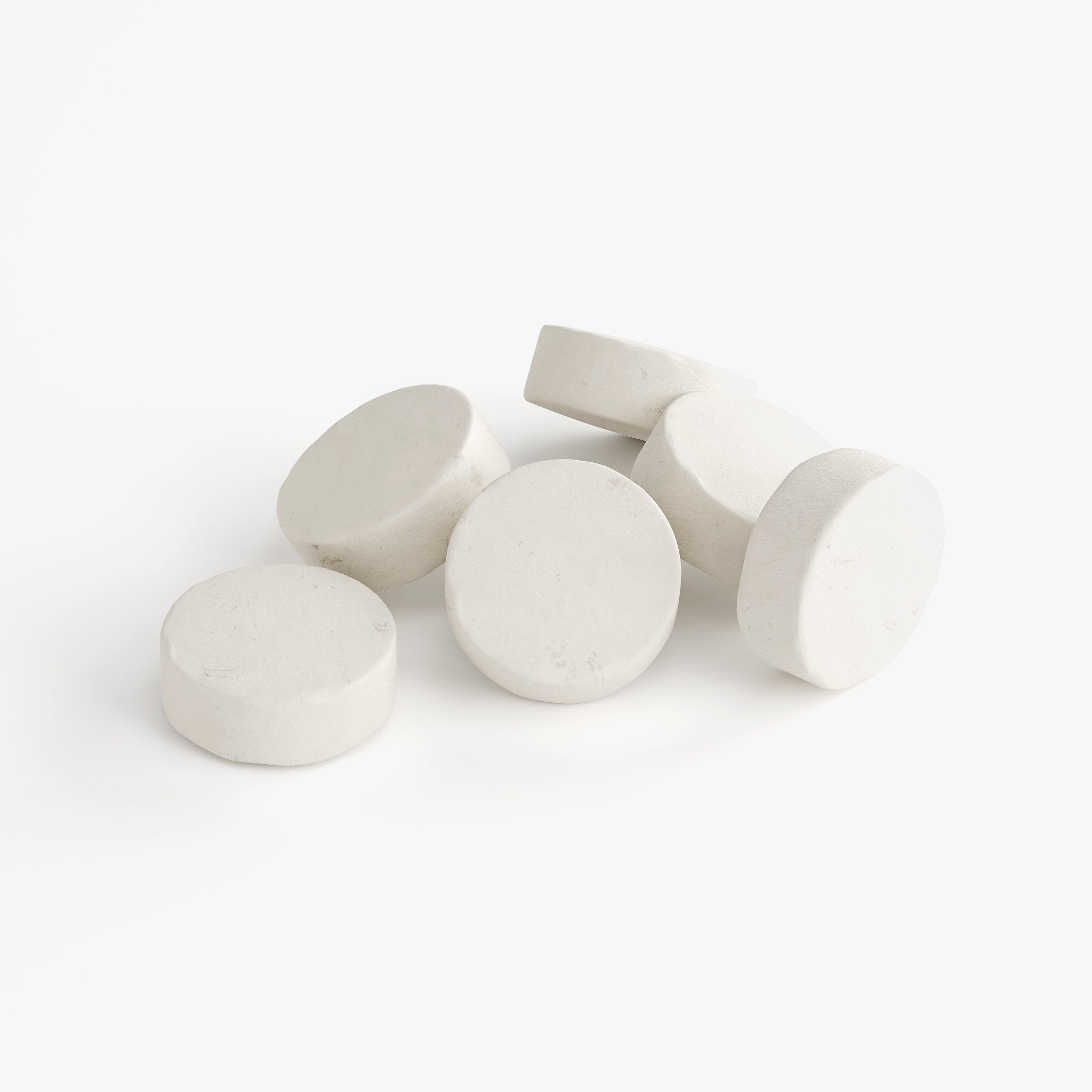 White round tablets on a white background