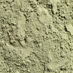 Close-up of greenish-brown soil with small stones