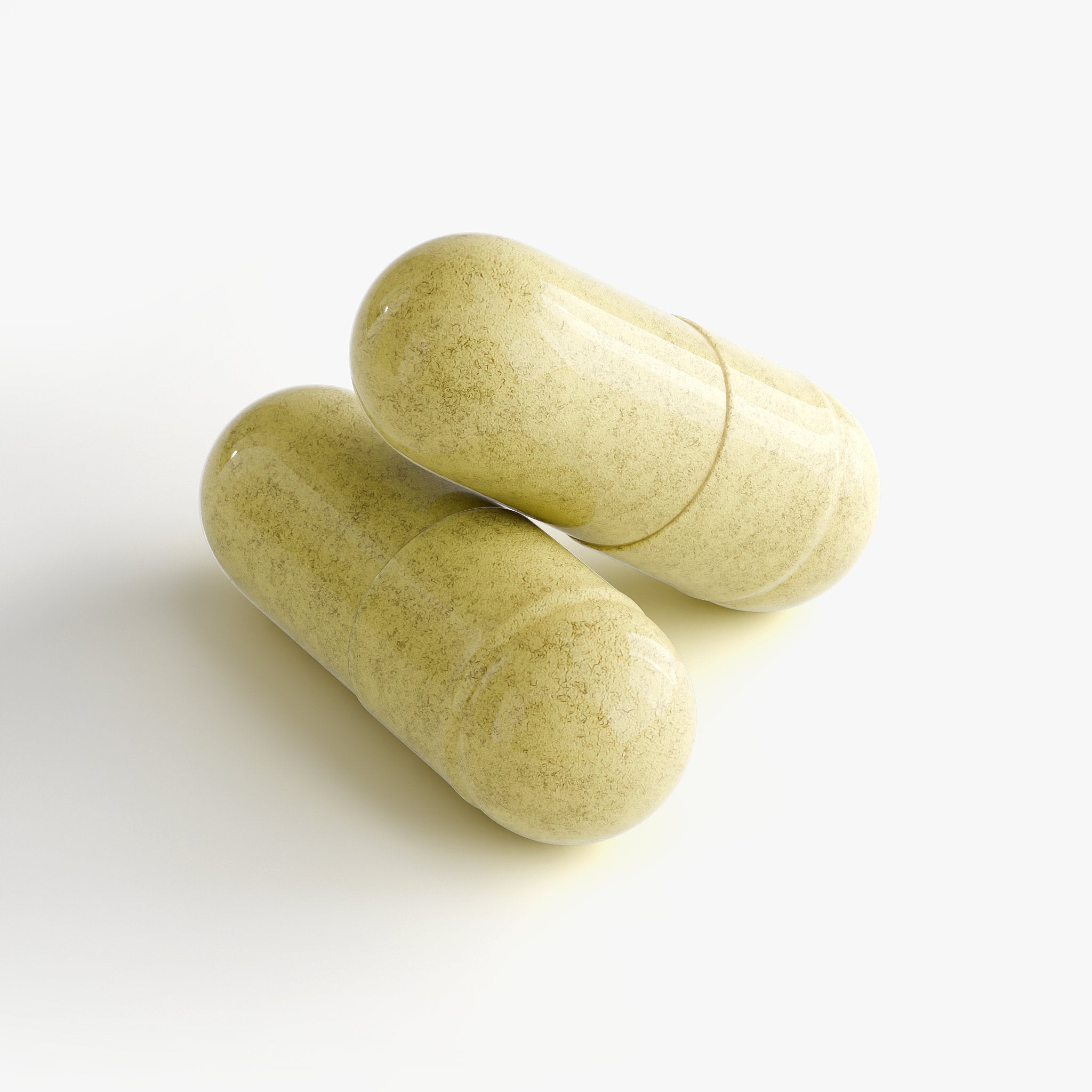 Two green capsules on a white background