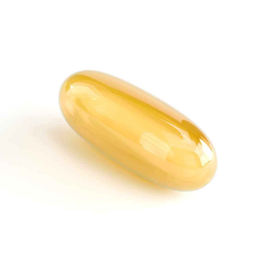 Yellow gelatin capsule on a white background