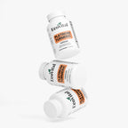 Three bottles of EcoVital Platinum Turmeric capsules on a white background