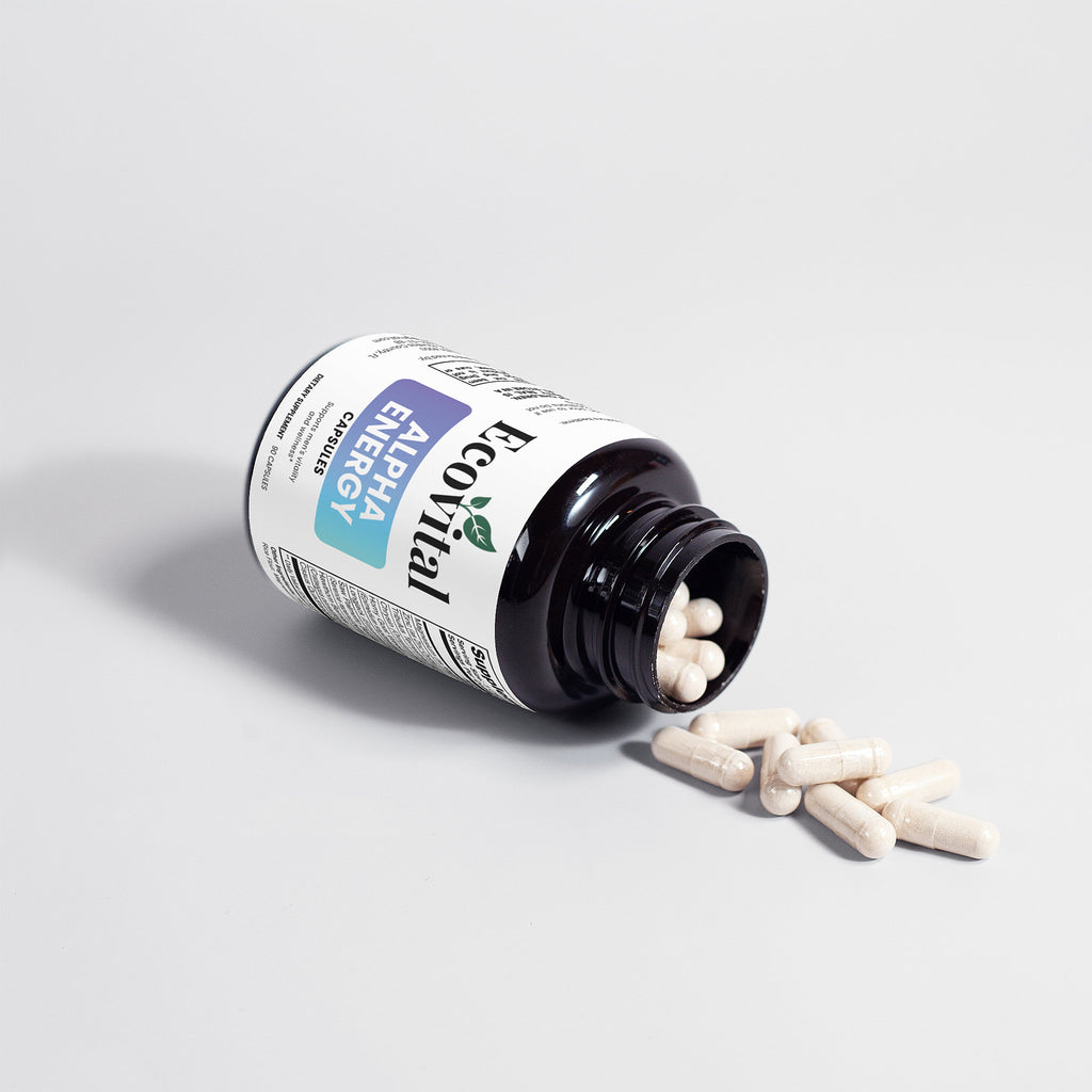 Bottle of Energetics Alpha Energy supplements with pills spilling out on a light gray background