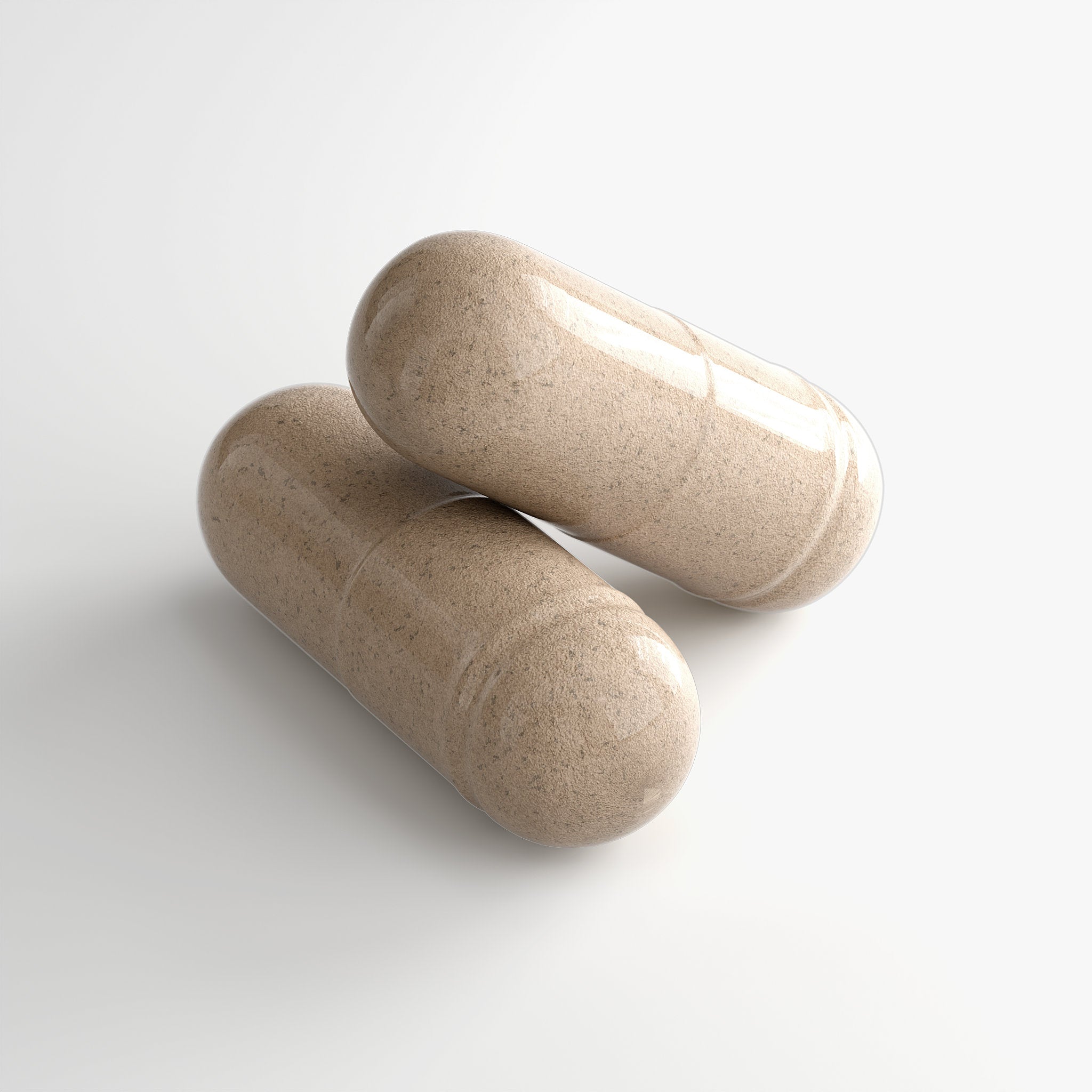 Two beige capsules on a light gray background