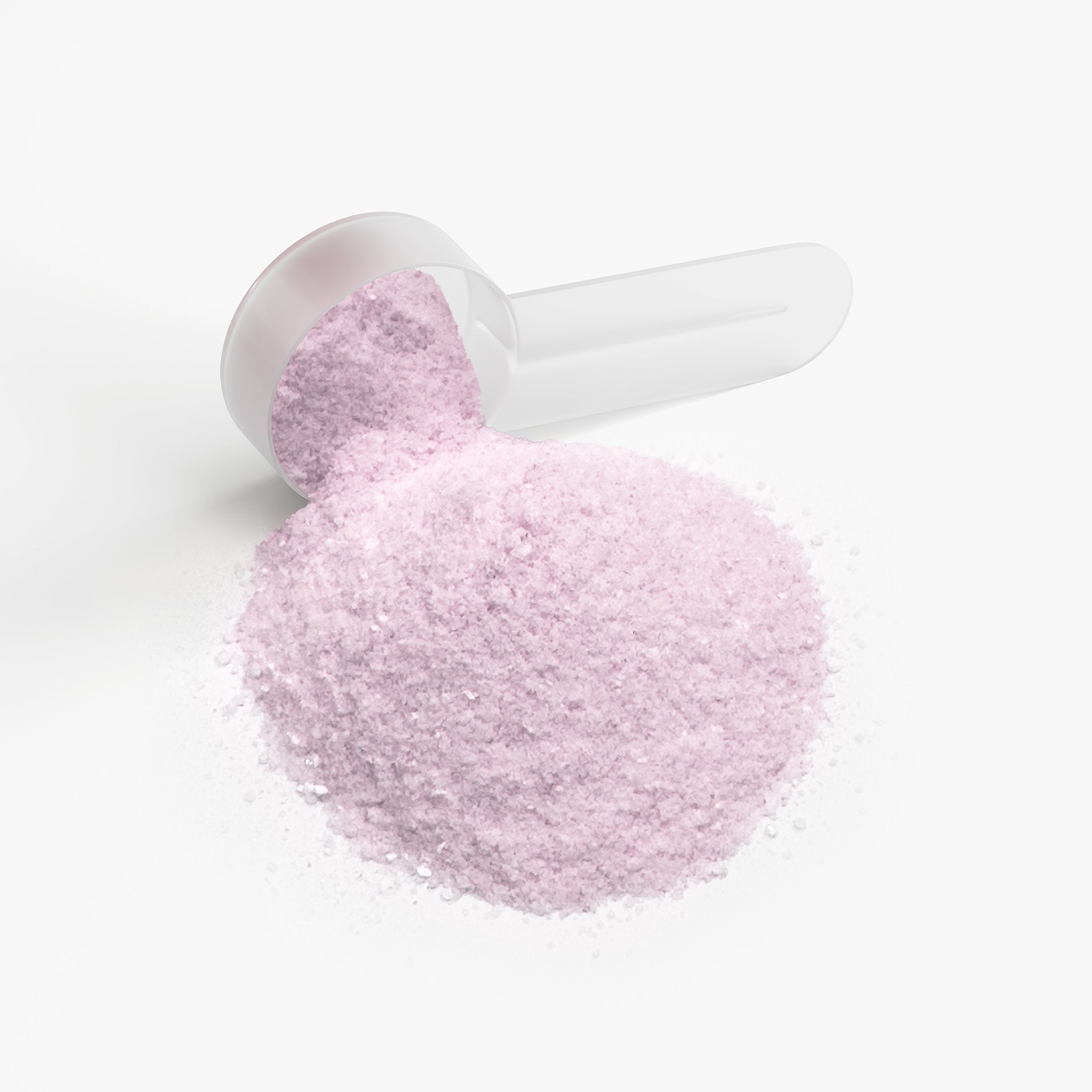 Pink bath salt in a white scoop on a white background