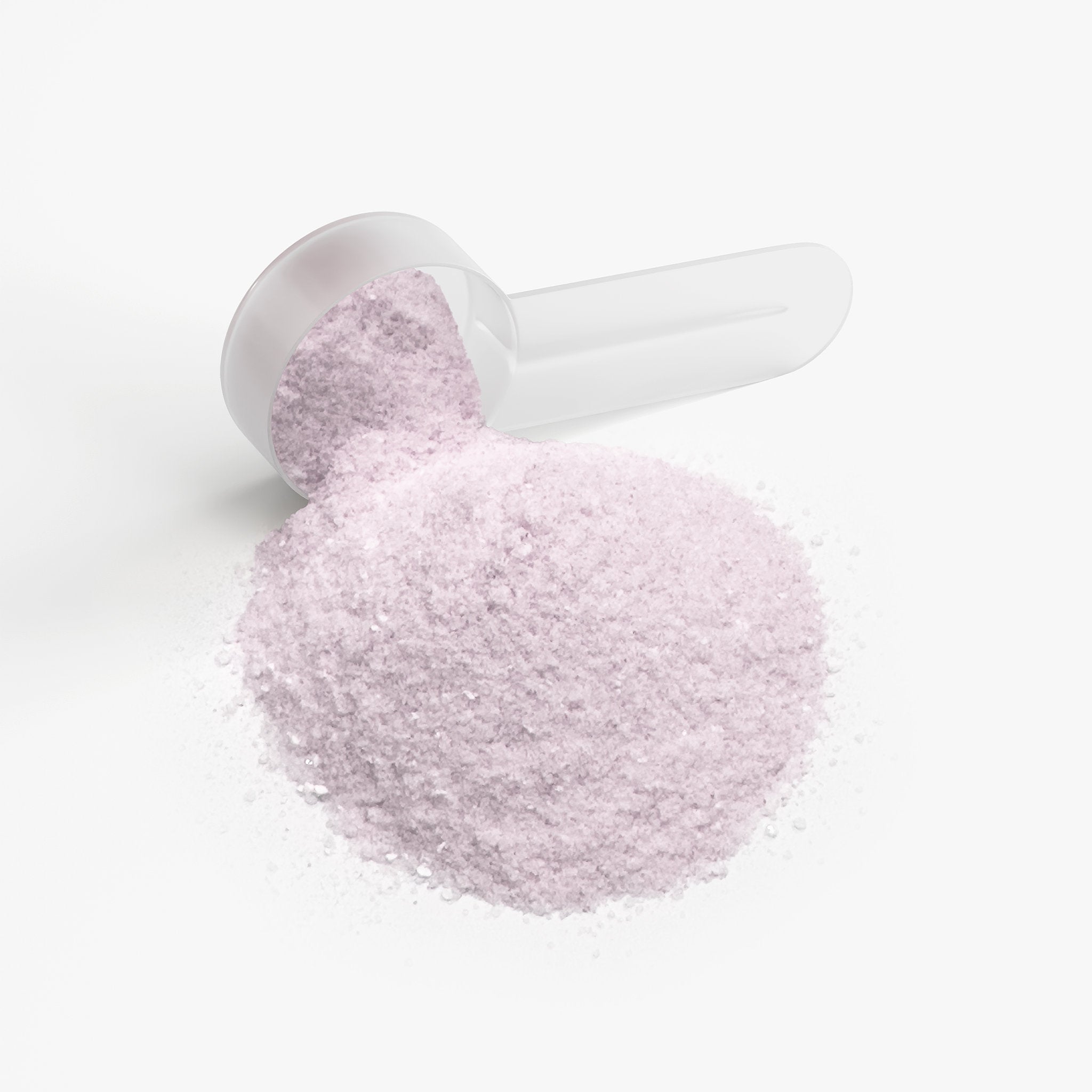 White scoop filled with pink powder on a white background