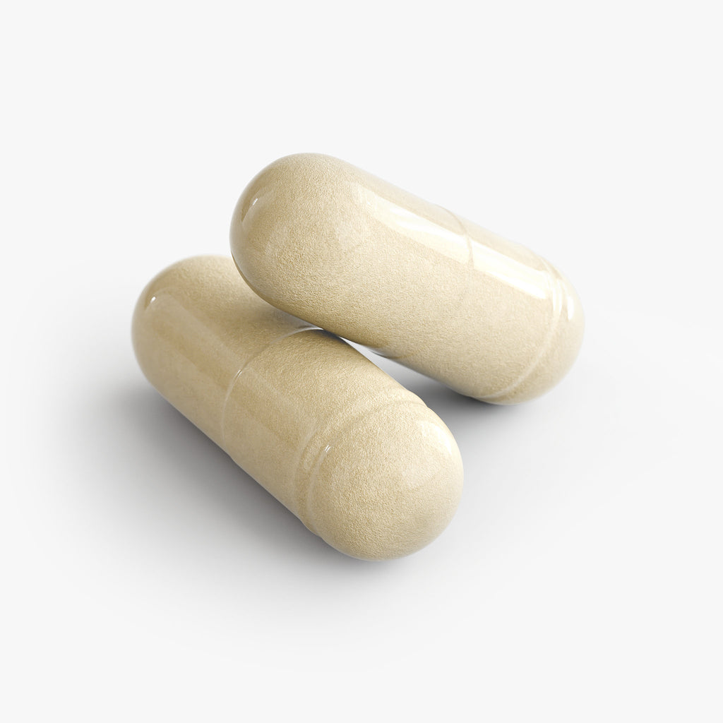 Two beige capsules on a white background