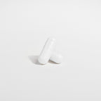 White ceramic vase on a light gray background