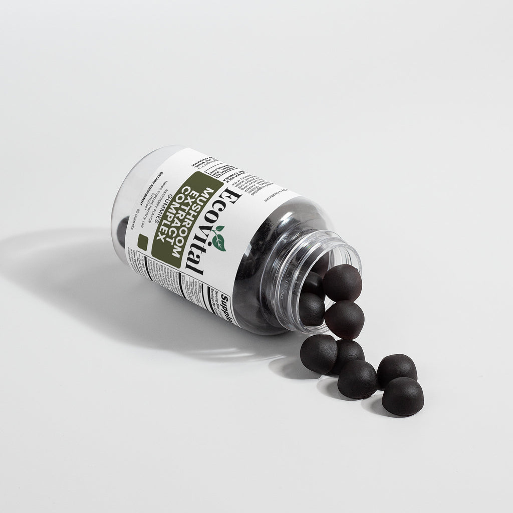 Bottle of black pills with a label on a light gray background