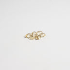 Gold oval-shaped objects on a light gray background